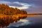 Sunset view of Jezioro Selmet Wielki lake landscape with vintage pier, reeds and shoreline in Sedki in Masuria region of Poland