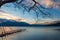 sunset view of lake Chuzenji with pier, tree and mountains near Nikko, Japan, autumn background