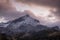 Sunset view of mountain peak Alpspitze with clouds in sky, Garmisch-Partenkirchen Bavaria