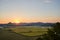 Sunset view of the mountains and fields near the Suncheonman Bay Wetland Reserve in South Korea