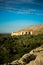 Sunset view of the Nakhal Fort surrounded by a palm grove, Oman