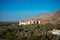 Sunset view of the Nakhal Fort surrounded by a palm grove, Oman