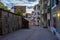 Sunset view of a narrow street winding through the historical ce