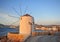 Sunset view of old windmill and Paros old town