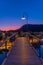 Sunset view over a wooden bridge leading to marina in Picton, New Zealand