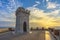 Sunset view of Piombino piazza bovio lighthouse and Elba Island.