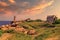 Sunset view of the Ploumanac`h Lighthouse and surroundings in Perros-Guirec on the Pink Granite Coast. Brittany, France.