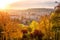 Sunset view of Prague from Vitkov hill with autumn park, scenic sunny cytiscape, Zizkov district, Czech Republic