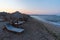 Sunset view of reed parasols at Shkorpilovtsi beach in Bulgaria.