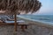 Sunset view of reed parasols at Shkorpilovtsi beach in Bulgaria.