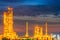 Sunset view of refinery petroleum and petrochemical plant in dustrial with distillation column and engineering equipment and pipe