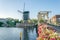 sunset view of Rembrandt bridge and de Put windmill in Leiden, Netherlands