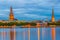 Sunset view of the Riga cathedral and saint James church from the other side of the Daugava river, Latvia....IMAGE