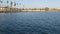 Sunset view of sea water from sailing boat or yacht, Oceanside harbor, summer vacations in California USA. City sign in