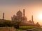 sunset view of the taj mahal with a monkey on the ghats at the banks of the yamuna river in agra