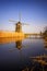 Sunset view at typical windmill at Kinderdijk, Holland.