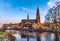 Sunset view of Uppsala cathedral reflecting on river Fyris in Sweden