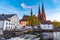 Sunset view of white building of Uppland museum and cathedral in Uppsala, Sweden