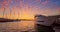 Sunset view in the yacht port. Luxury yacht and speed boats moored in the bay. Travel and tourism concept. Varna, Bulgaria