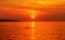 Sunset in vivid orange color on the amazing seascape in hot summer day