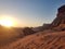 Sunset in Wadi Rum desert. Sundown and rocky mountains. Peaceful desert landscape.