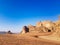 Sunset in Wadi Rum desert. Sundown and rocky mountains. Safari ride on pick up trucks.