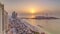 Sunset waterfront overview Jumeirah Beach Residence JBR skyline aerial time lapse with yacht and boats