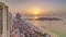 Sunset waterfront overview Jumeirah Beach Residence JBR skyline aerial timelapse with yacht and boats