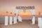 Sunset. Wedding ceremony arch with flowers decorative arrangement and white curtain on cliff above sea, sunrise outdoor summer ph
