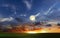 Sunset on wild field sun down and moon rise on starry cloudy  sky green grass nature landscape  Description95/20