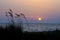 Sunset on the wilderness and natural red sand beach of Chalikounas in Corfu