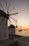 Sunset at the windmills of Mykonos and yacht