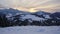 Sunset in winter snowy mountain scenery, slow movement of clouds ,timelapse