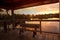 Sunset Wooden bench on a secluded, tranquil boardwalk along a ma