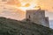 Sunset at the Xlendi Tower on the island of Gozo, Mal