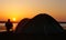 Sunsets behind camper and tent