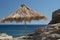 Sunshade on the Greek rocky beach