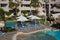 sunshade umbrellas and sunbeds near pool in Jaz Casa Del Mar Resort in Hurghada, Egypt