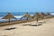 Sunshades at an empty beach