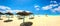 Sunshades on the sandy beach at sunny day. Nabeul, Tunisia, North Africa