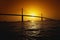 This is the Sunshine Bridge. It is one of the longest suspension bridges in North America. The ocean is shown in the foreground wi