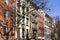 Sunshine on a colorful block of buildings in New York City