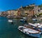 Sunshine highlights the multi-coloured buildings of the old town of Porto Venere, Italy