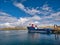 In sunshine, the interisland car ferry MV Filla moored at Symbister on the island of Whalsay