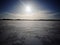 Sunshine over an iced lake
