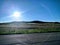 Sunshine Over Rural Farmland as Seen from a Highway