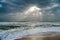 Sunshine pouring over the sea  through the clouds view from beach of somnath