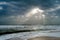 Sunshine pouring over the sea  through the clouds view from beach of somnath