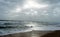 Sunshine pouring over the sea  through the clouds view from beach of somnath