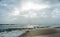 Sunshine pouring over the sea  through the clouds view from beach of somnath